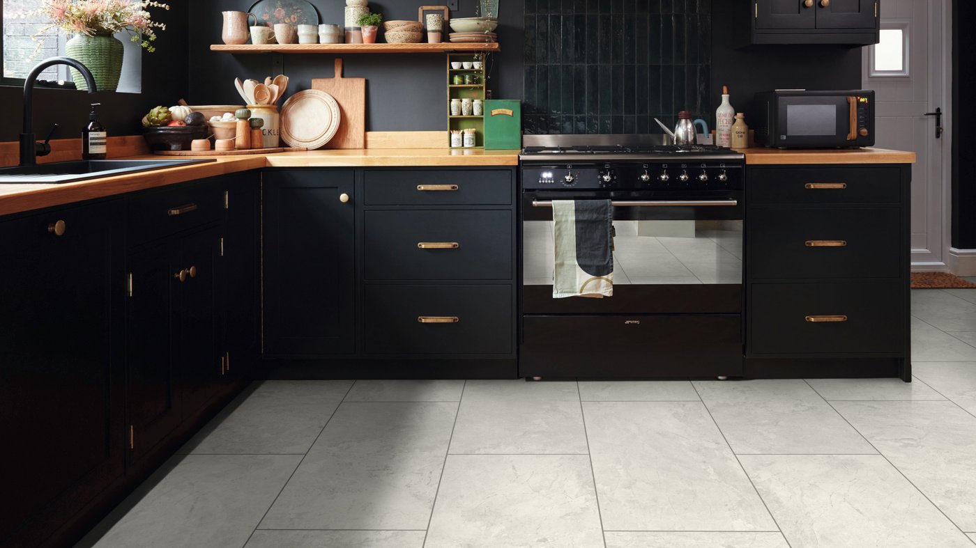 Bianco Breccia Marble lvp floors add contrast to a modern kitchen