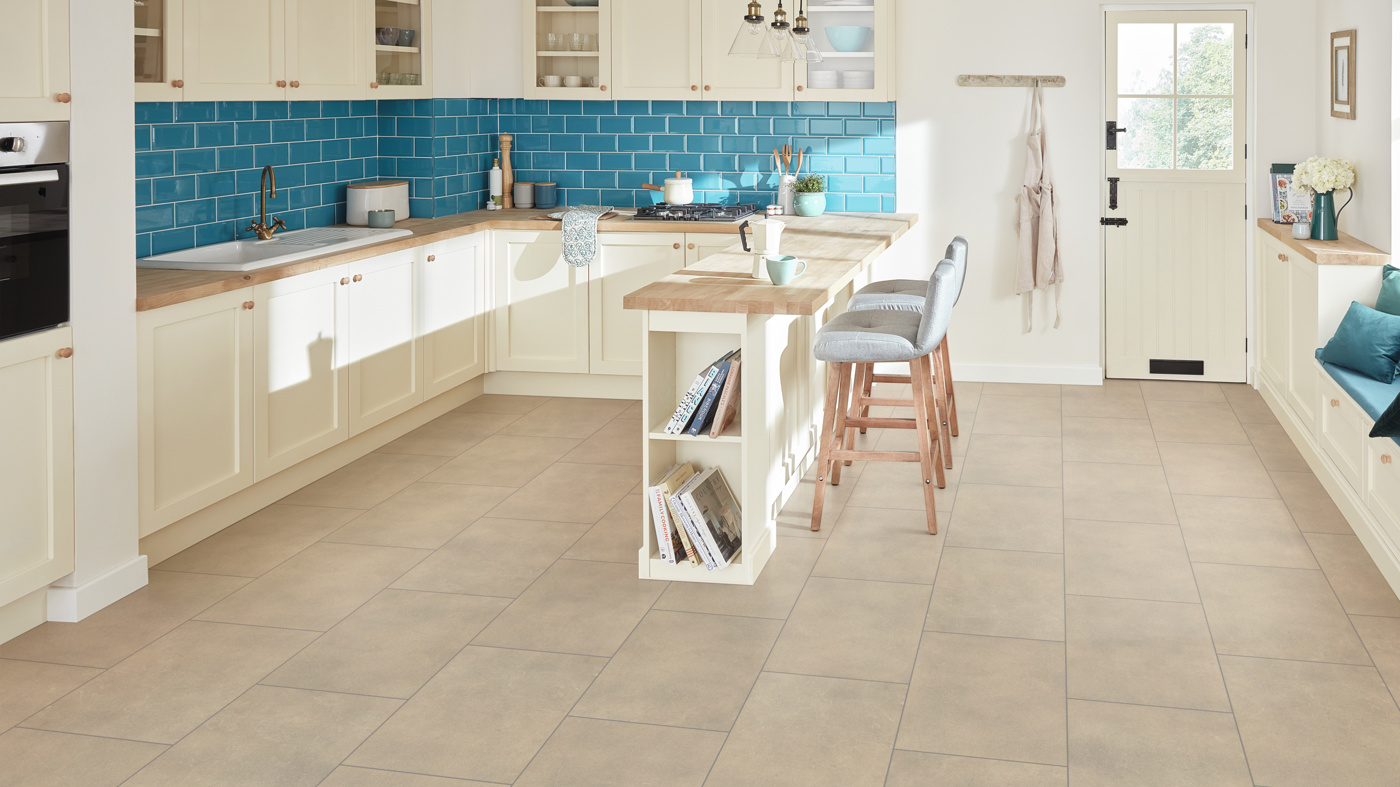Cotswold Stone grounds the bright kitchen with light blue accents