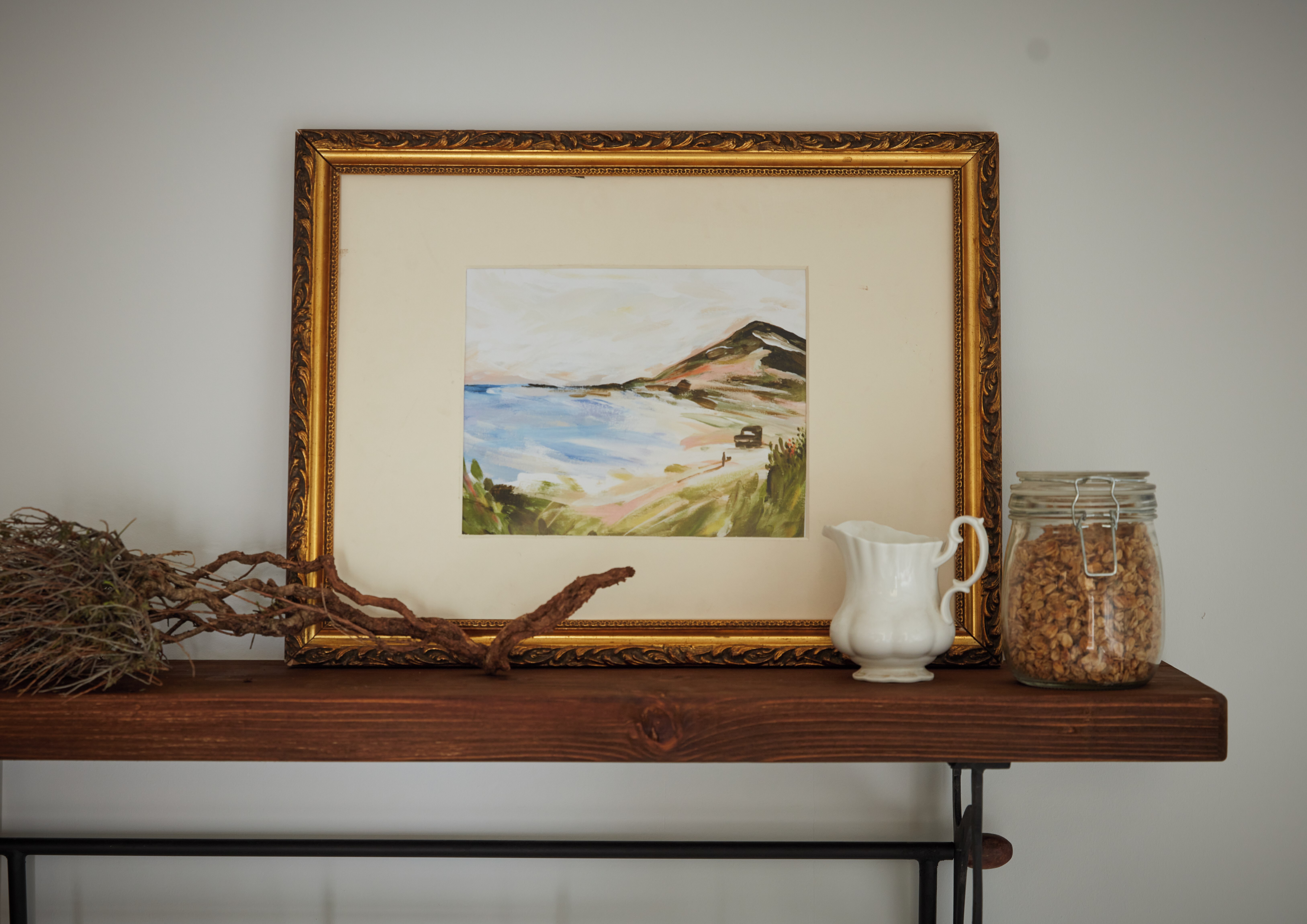 Nature painting on a wooden shelf