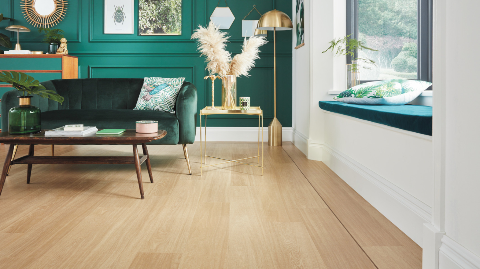 A living room in the Mix + Max design aesthetic featuring jewel tones, a gallery wall and French Oak floors