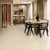 Natural Limestone gluedown lvt floors in an open plan kitchen and dining room