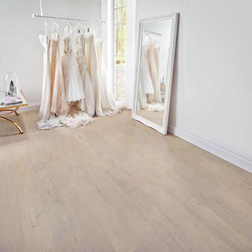 Knight Tile Coastal sawn oak light brown lvt flooring in a retail shop