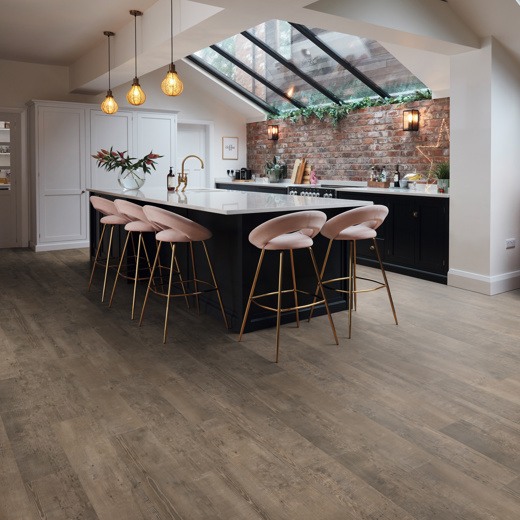 Smoked School Cedar lvp floors in an open plan kitchen; avaiable in gluedown and rigid core